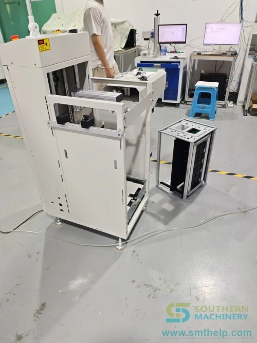 PCB magazine loader feeding an SMT production line as board-handling equipment